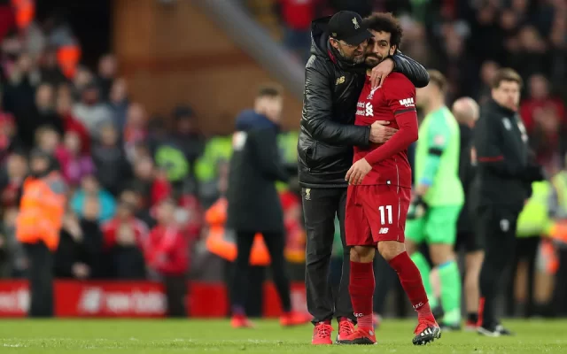 Jurgen Klopp embraces Mohamed Salah