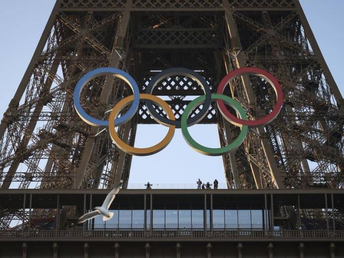 Olympic rings displayed on Eiffel Tower 50 days before Paris 2024 Games