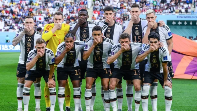 After FIFA threatened to ban the players, German players protested by putting their hands over their mouths