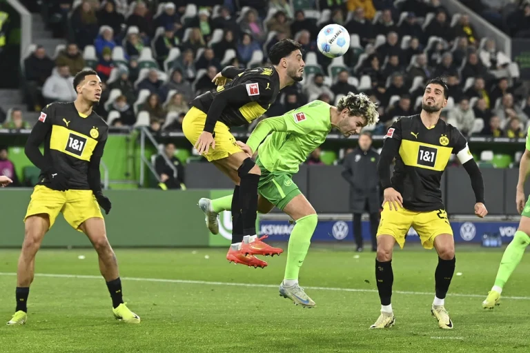 Dortmund move into top 6 after rapid treble rocks Wolfsburg