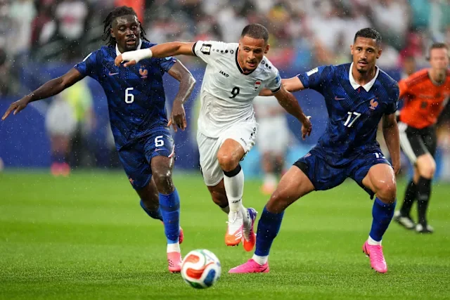 Iraq's Ali Alhamadi (C) battles for the ball with France's William Saliba (R) and Manu Kone during the 2026 FIFA World Cup group I soccer match between France and Iraq at Philadelphia Stadium. Kyle Rodden/CSM via ZUMA Press Wire/dpa