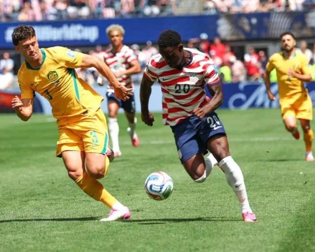Folarin Balogun of the USA runs with the ball past Australia defender Alessandro Circati during the World Cup Group D clash in Seattle. Photograph: Melissa Levin/ZUMA Press Wire/Shutterstock
