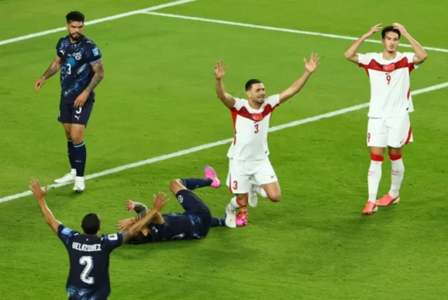 Turkiye’s’s Merih Demiral and Deniz Gul react after a late chance went wide [Eloisa Lopez/Reuters]
